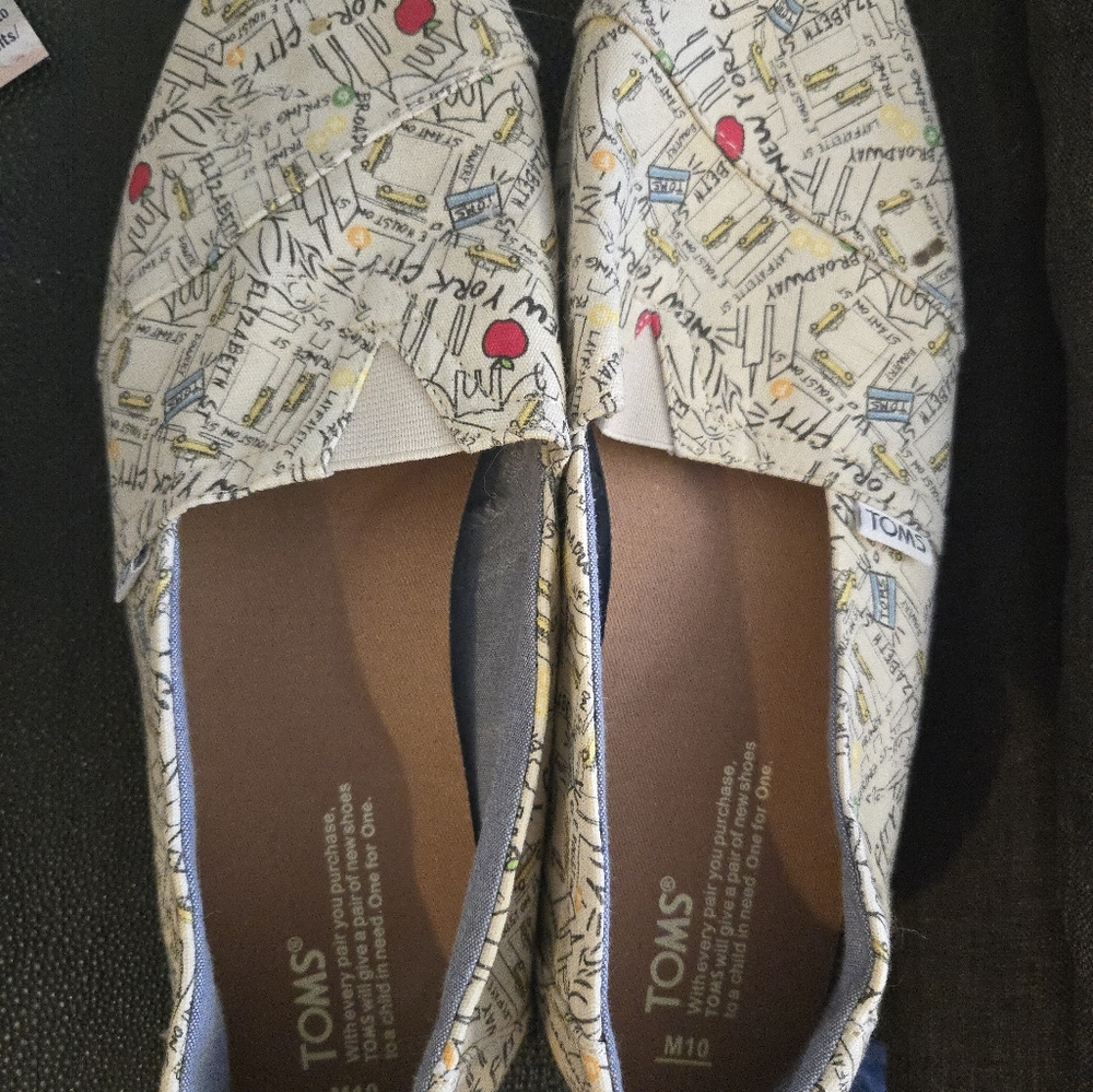Toms Cream Loafers with Classic Slip-On Style